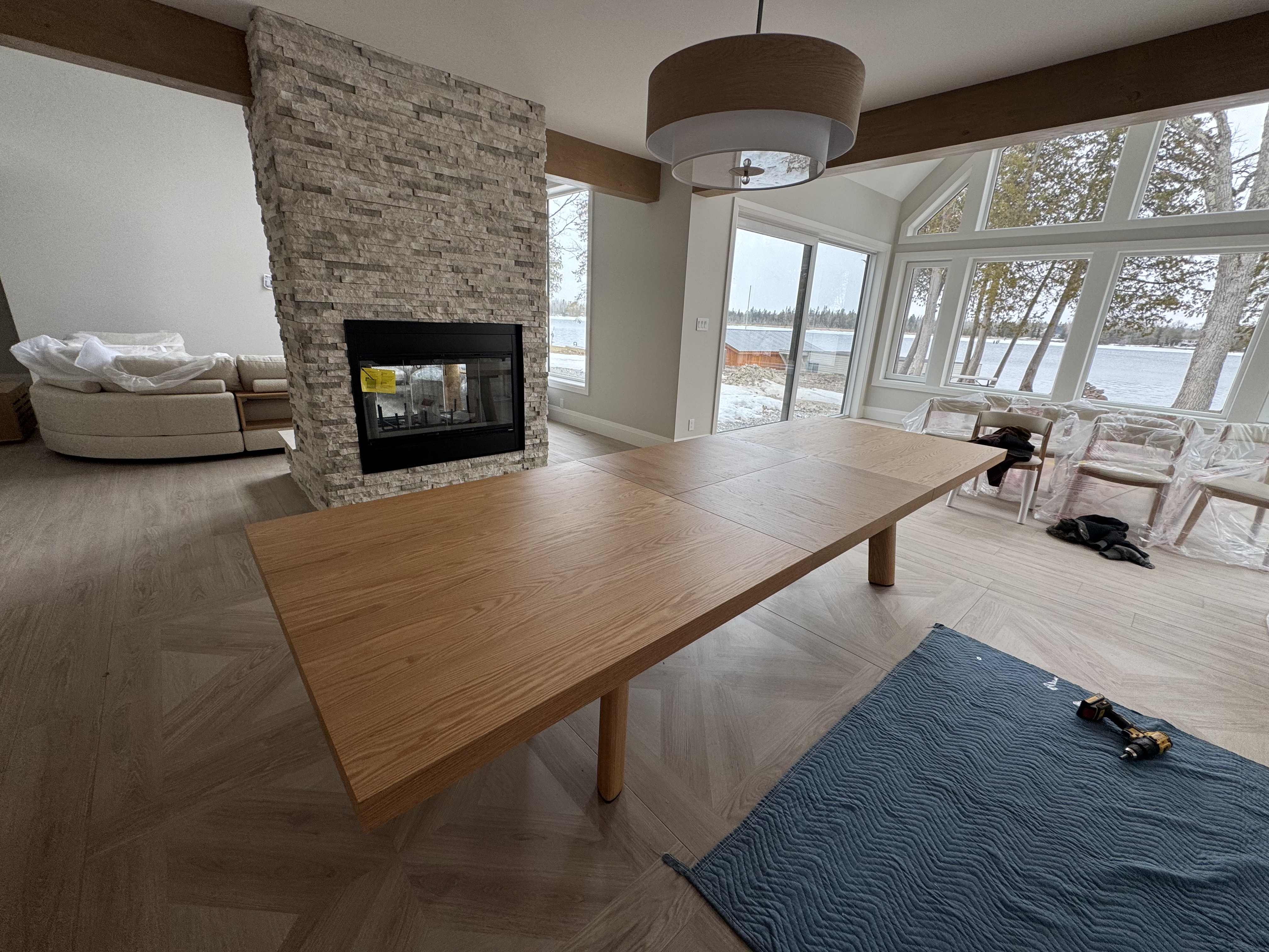 Professional furniture installation team carefully placing furniture in a Toronto interior design project